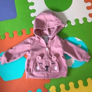 Pink zip up hoodie with bear ears on the pockets